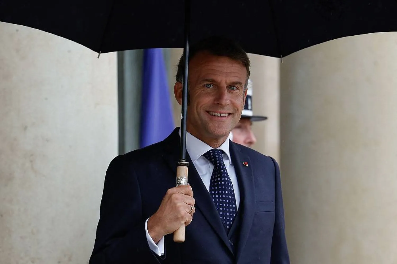 France's President Emmanuel Macron looks on as he waits for Lebanon's Prime Minister ahead of their working lunch at the presidential Elysee Palace in Paris, on July 24, 2025. (AFP)