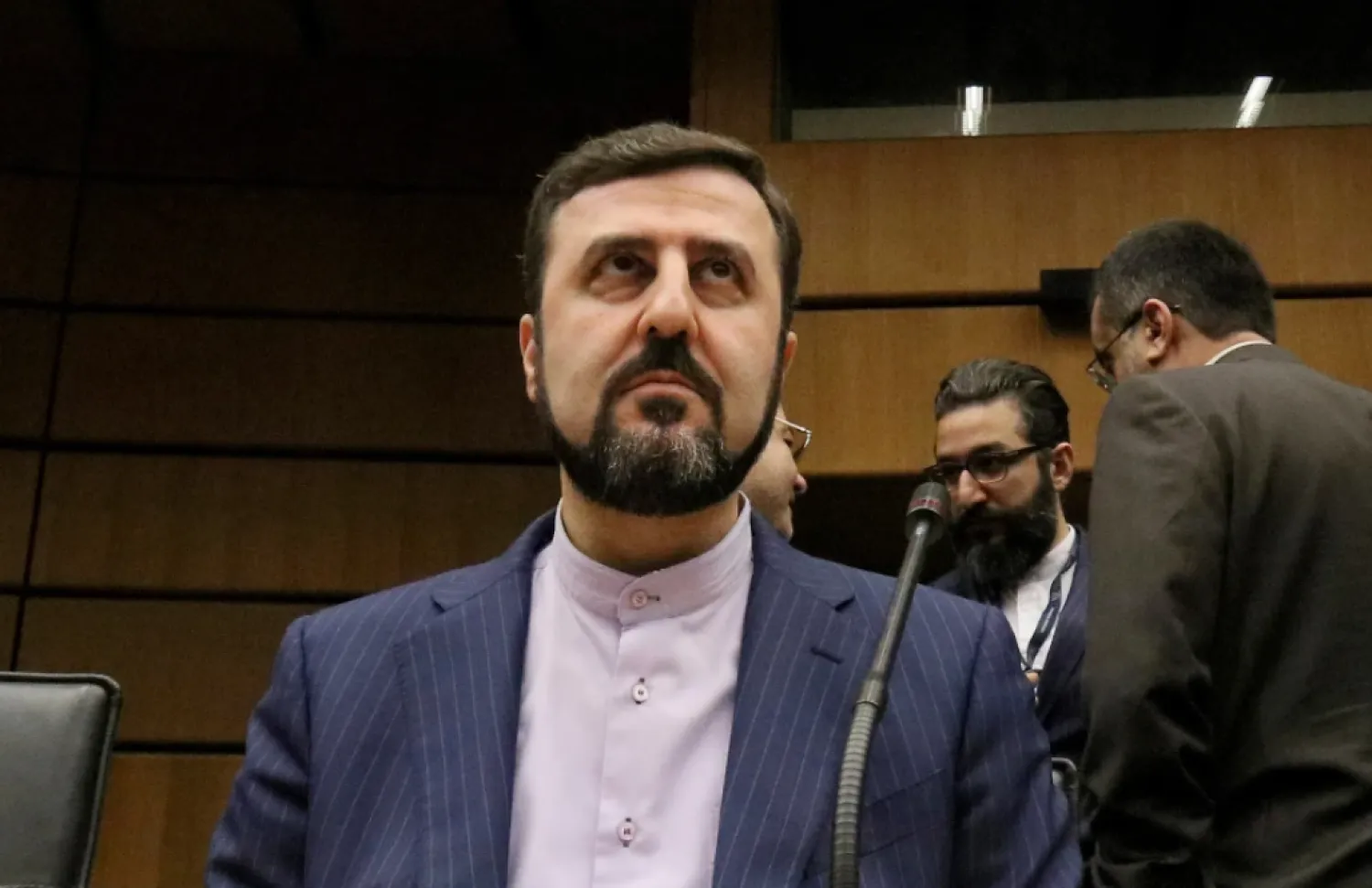 Iran’s Ambassador to the International Atomic Energy Agency, IAEA, Kazem Gharibabadi, waits for the start of the IAEA board of governors meeting at the International Center in Vienna, Austria, Nov. 21, 2019. (AP Photo/Ronald Zak, file)