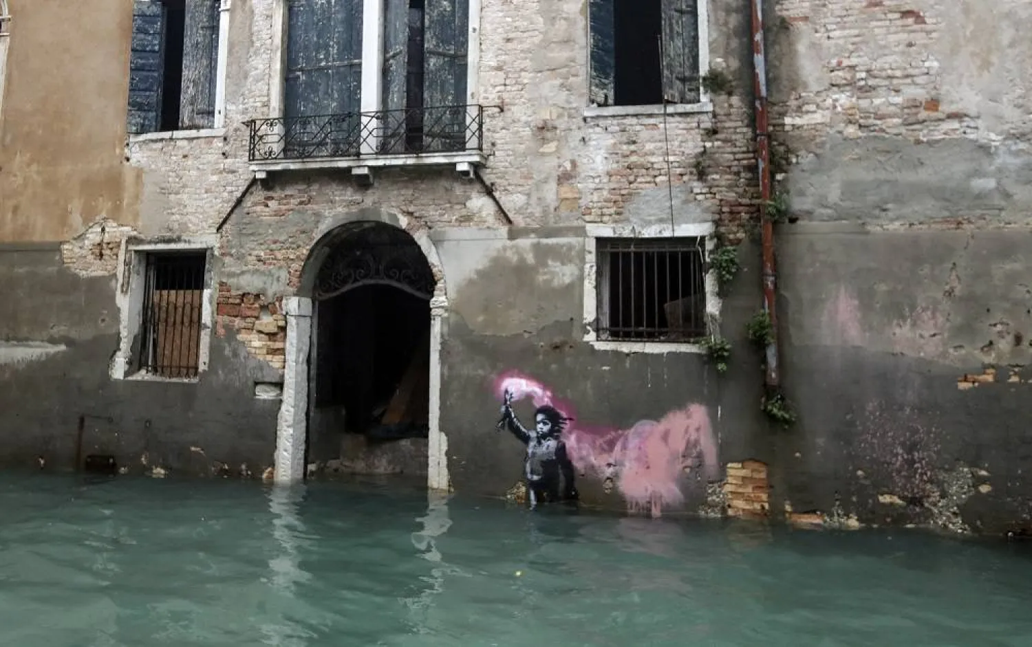 The Bansky work "The Migrant Child" is partially submerged in Venice, Italy, Nov. 15, 2019. (AP) 