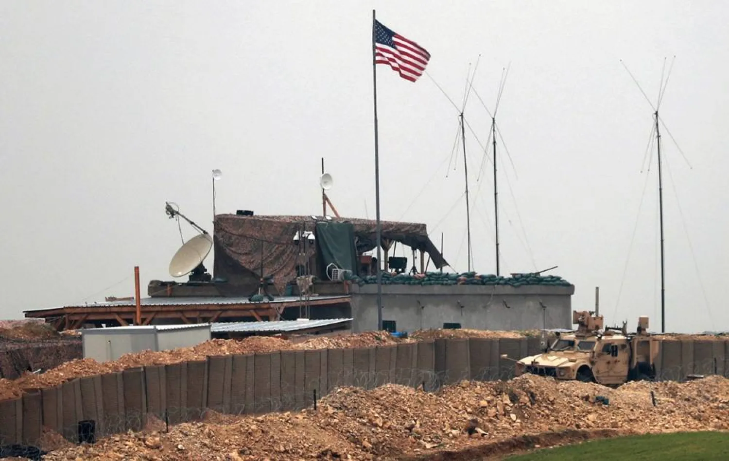  US forces vehicles and structures are seen on the outskirts of the northern Syrian town of Manbij on December 26, 2018. (AFP)