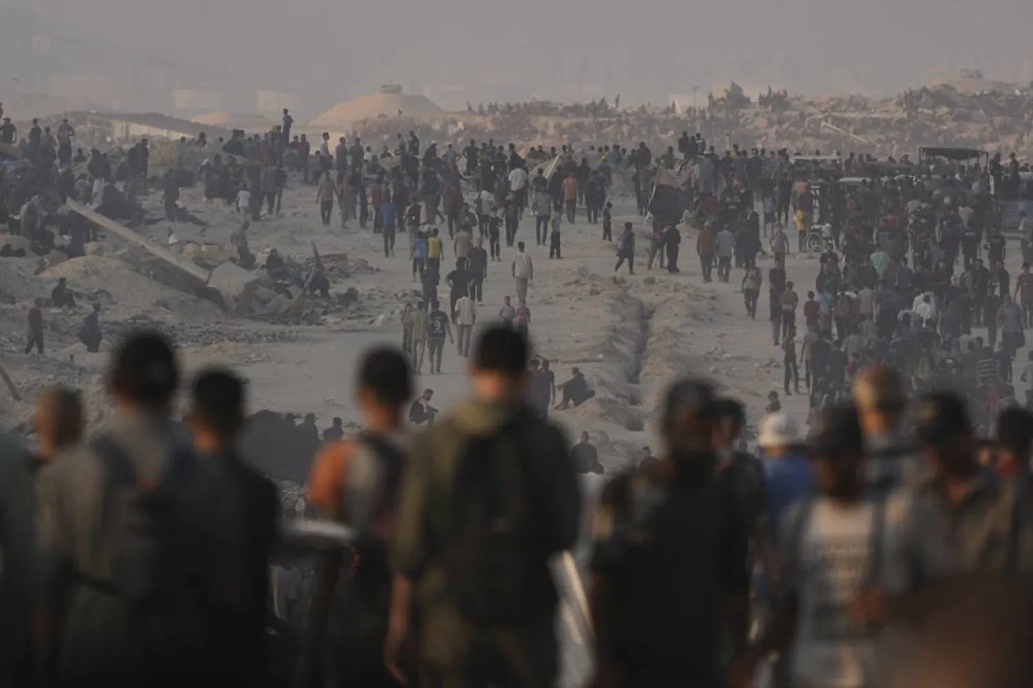 Palestinians wait for food aid trucks to enter from northern Gaza, in Gaza City, Friday, July 25, 2025. (AP)