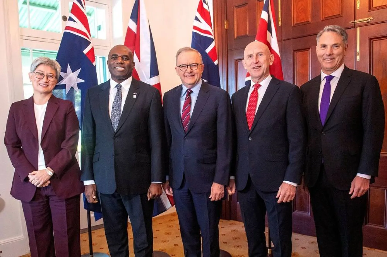 Australian Prime Minister Anthony Albanese (C) poses with Australia’s Foreign Minister Penny Wong (L), Britain’s Foreign Secretary David Lammy (2nd-L), Britain’s Defense Secretary John Healey (2nd-R) and Australia’s Deputy Prime Minister and Minister for Defense Richard Marles (R) before the start of the Australia-UK Ministerial Consultations (AUKMIN) meeting in Sydney on July 25, 2025. (AFP) 