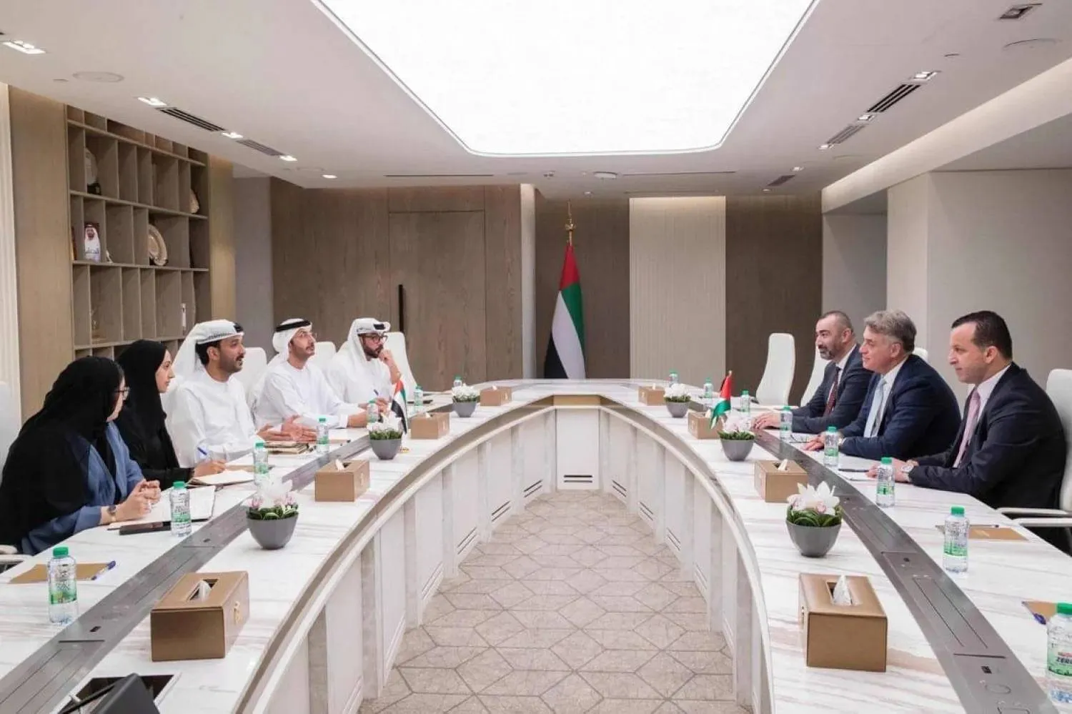 Abdullah bin Touq Al Marri, UAE Minister of Economy and Tourism, and Yehya Shunnar, Governor of the Palestine Monetary Authority and Chairman of the Anti-Money Laundering Committee, during a meeting with officials. (WAM) 