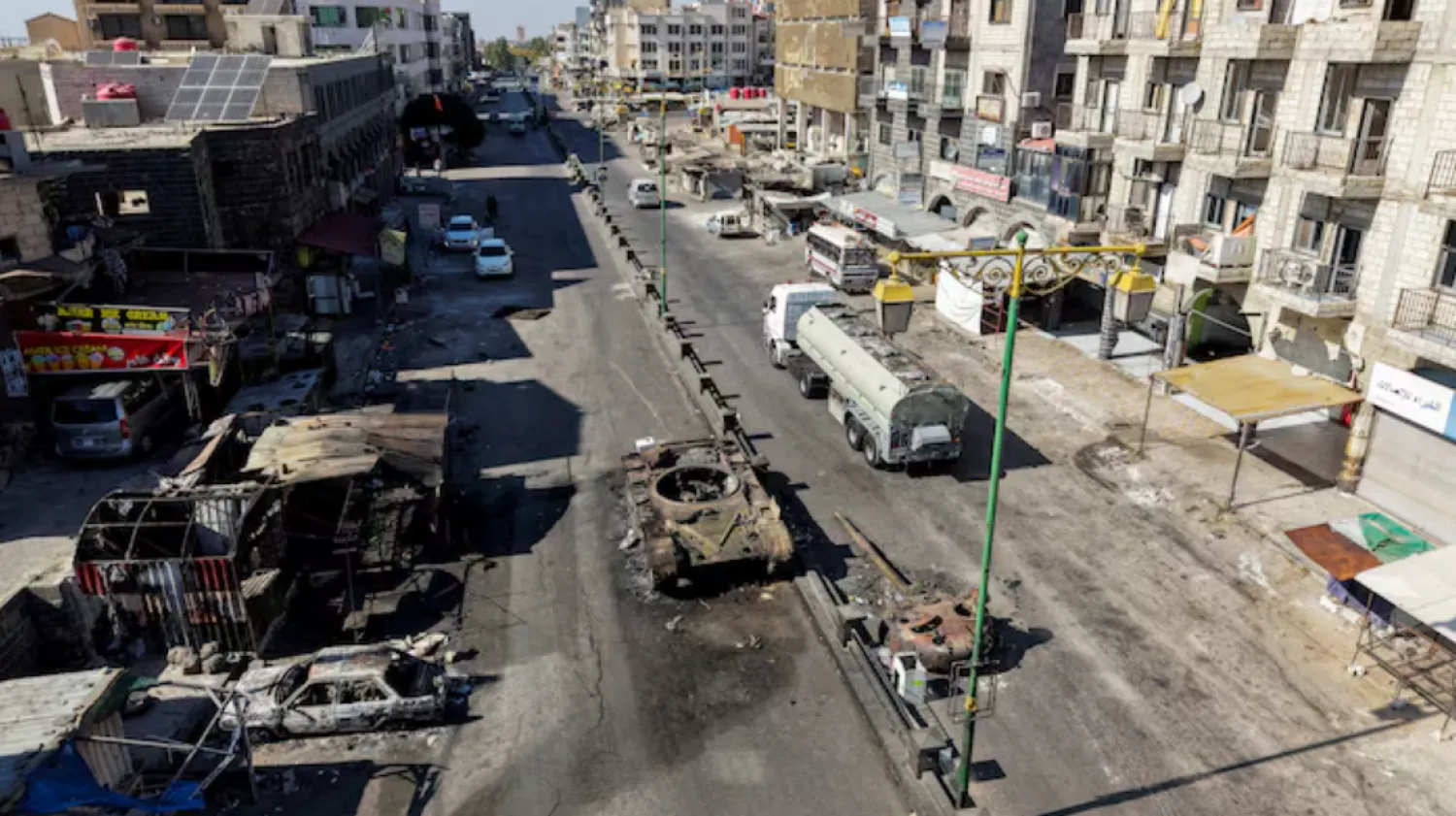 A drone view shows the remains of a destroyed tank, following deadly clashes between Druze fighters, Bedouin tribes and government forces, in Syria's predominantly Druze city of Sweida, Syria July 25, 2025. REUTERS/Khalil Ashawi/File Photo 