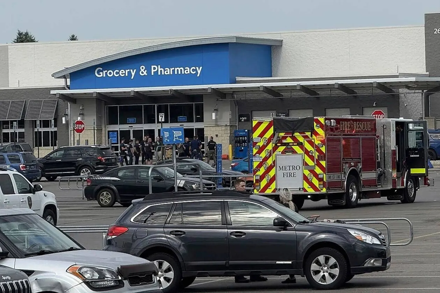 Emergency services respond after multiple people were stabbed at Walmart in Traverse City, Mich., Saturday, July 26, 2025. (Jan-Michael Stump/Traverse City Record-Eagle via AP)