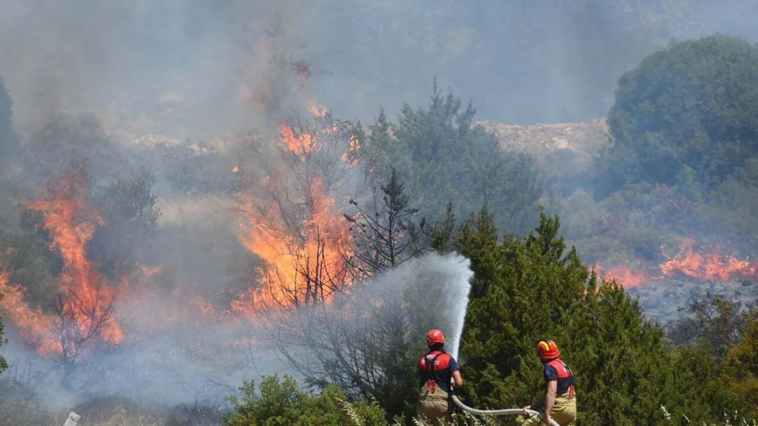 Firefighters have been working to extinguish a wildfire in the western Turkish province of Izmir. HANDOUT / DHA (Demiroren News Agency)/AFP
