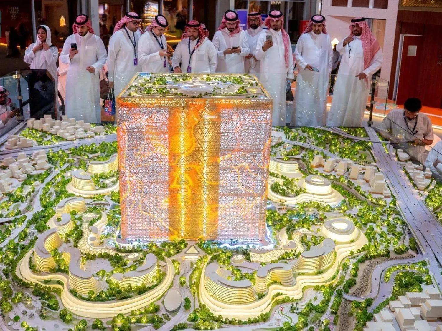 People look at models of residential projects at the Cityscape exhibition held in Riyadh. (SPA) 