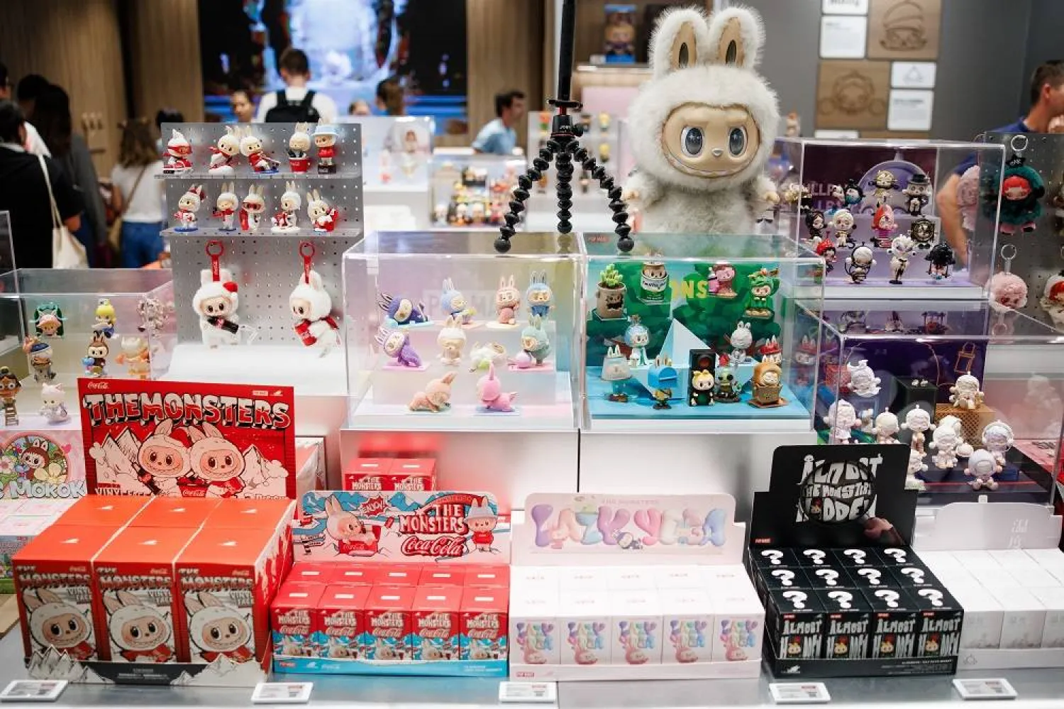 Customers walk around plush figures and toys on display in the first Pop Mart store selling Labubu toys in Berlin, Germany, 25 July 2025. (EPA)