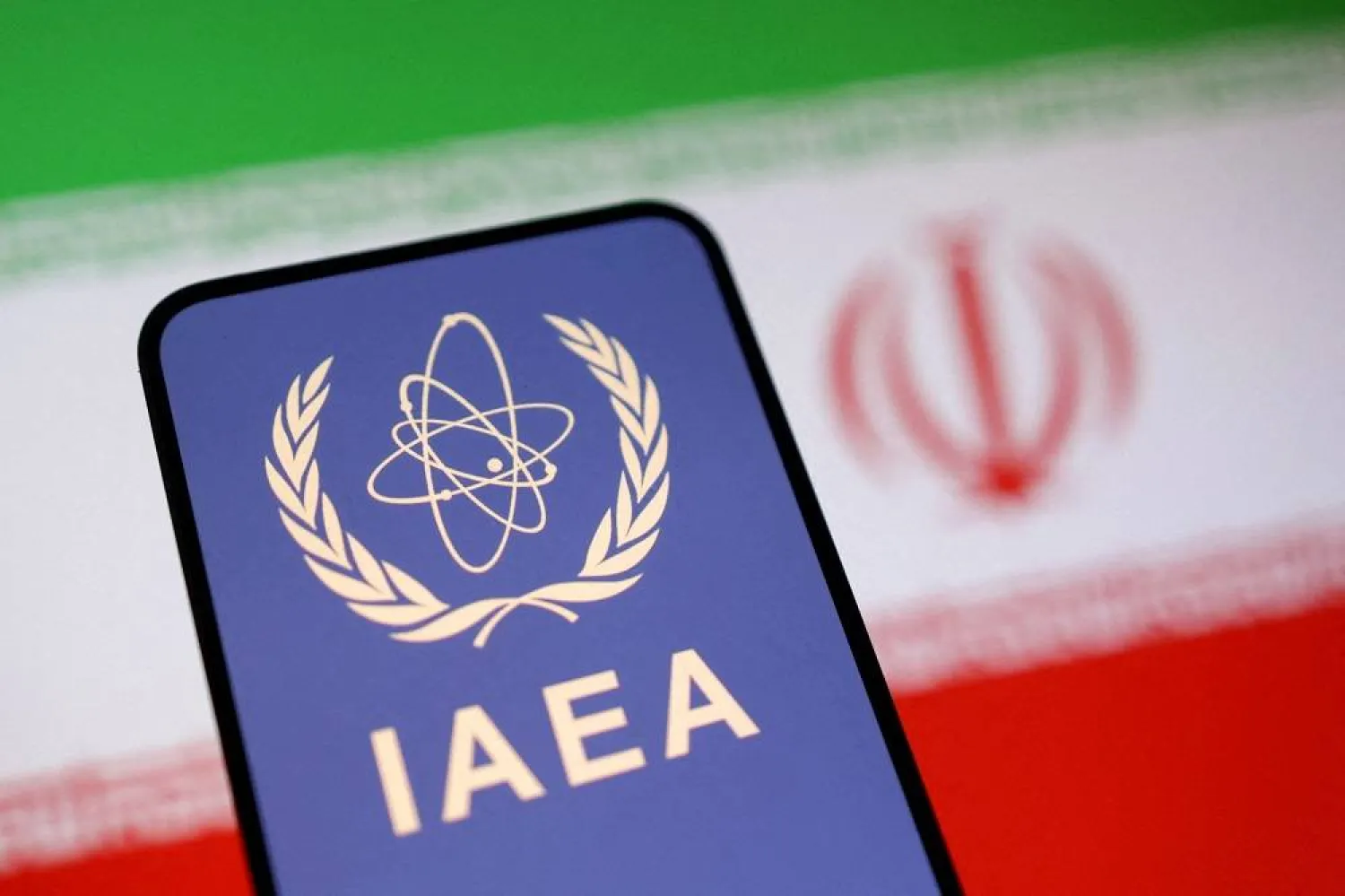 The International Atomic Energy Agency (IAEA) logo and Iranian flag is seen in this illustration taken June 16, 2025. (Reuters)