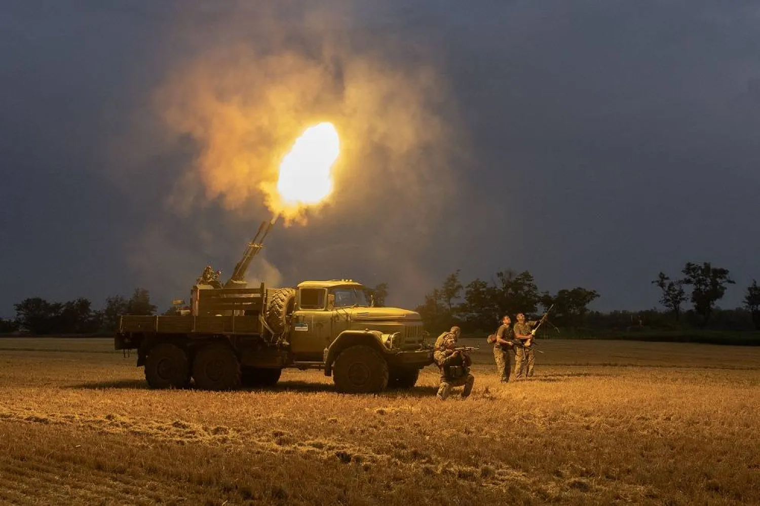 Ukrainian servicemen of the 59th brigade mobile air defense unit fire a Soviet made ZU-23 anti-aircraft twin autocannon towards a Russian drone during an air attack near Pavlograd, Dnipropetrovsk region on July 19, 2025, amid the Russian invasion of Ukraine. (AFP)