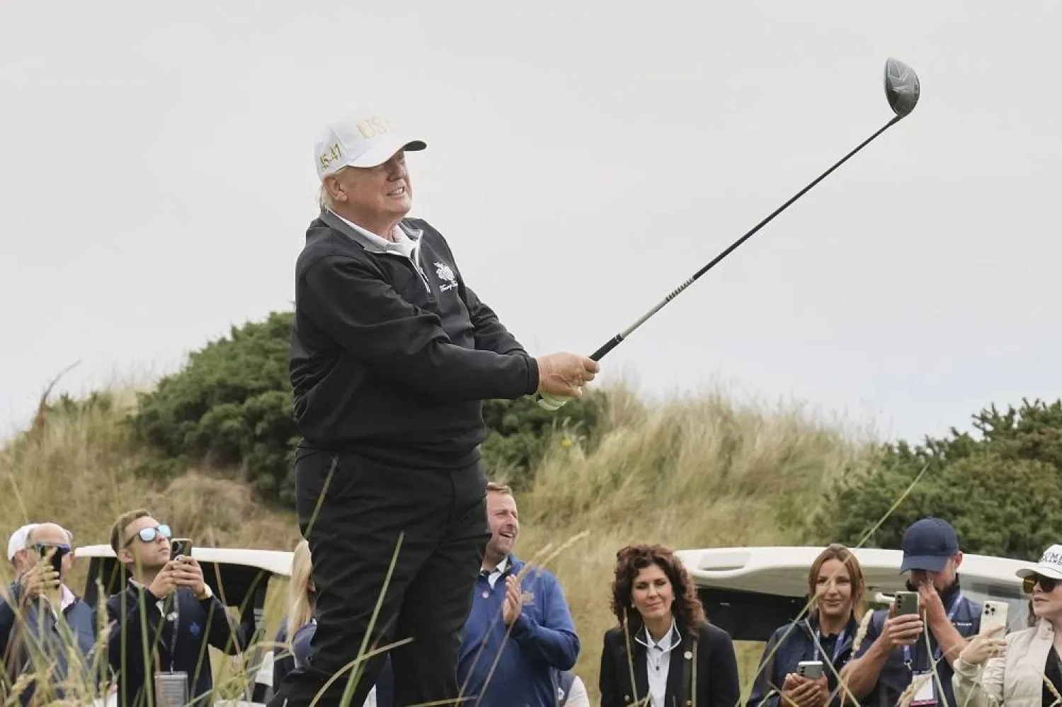 President Donald Trump tees off during the opening ceremony for the Trump International Golf Links golf course, near Aberdeen, Scotland, Tuesday, July 29, 2025. (AP)