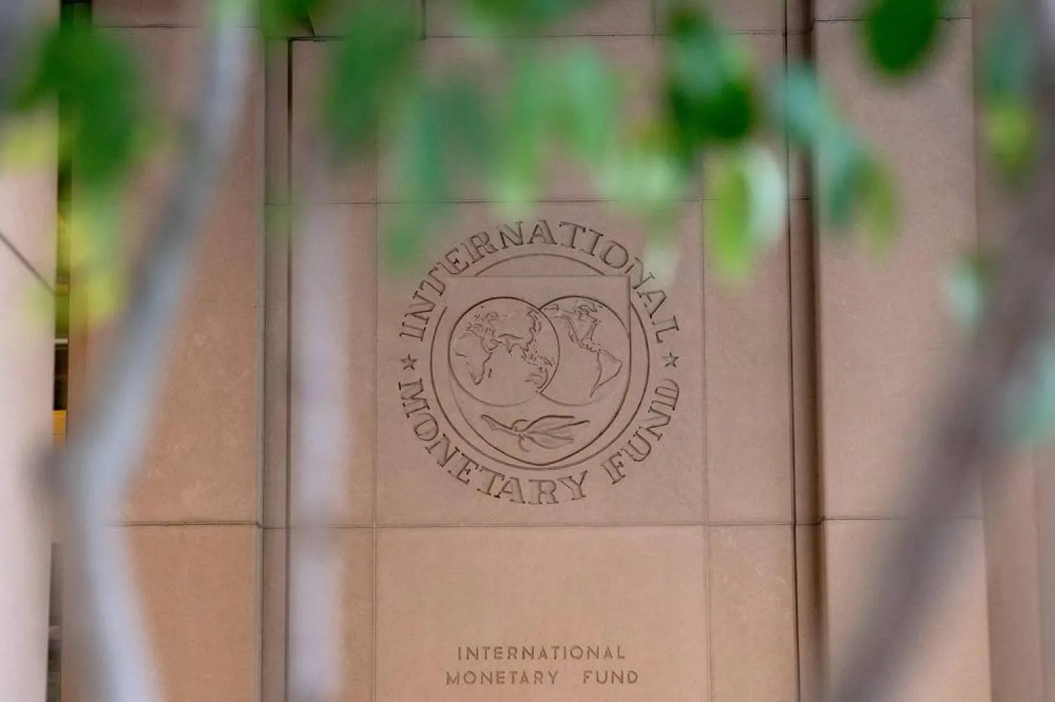 The International Monetary Fund (IMF) logo is displayed outside its headquarters in Washington, DC, on October 8, 2022. (AFP)