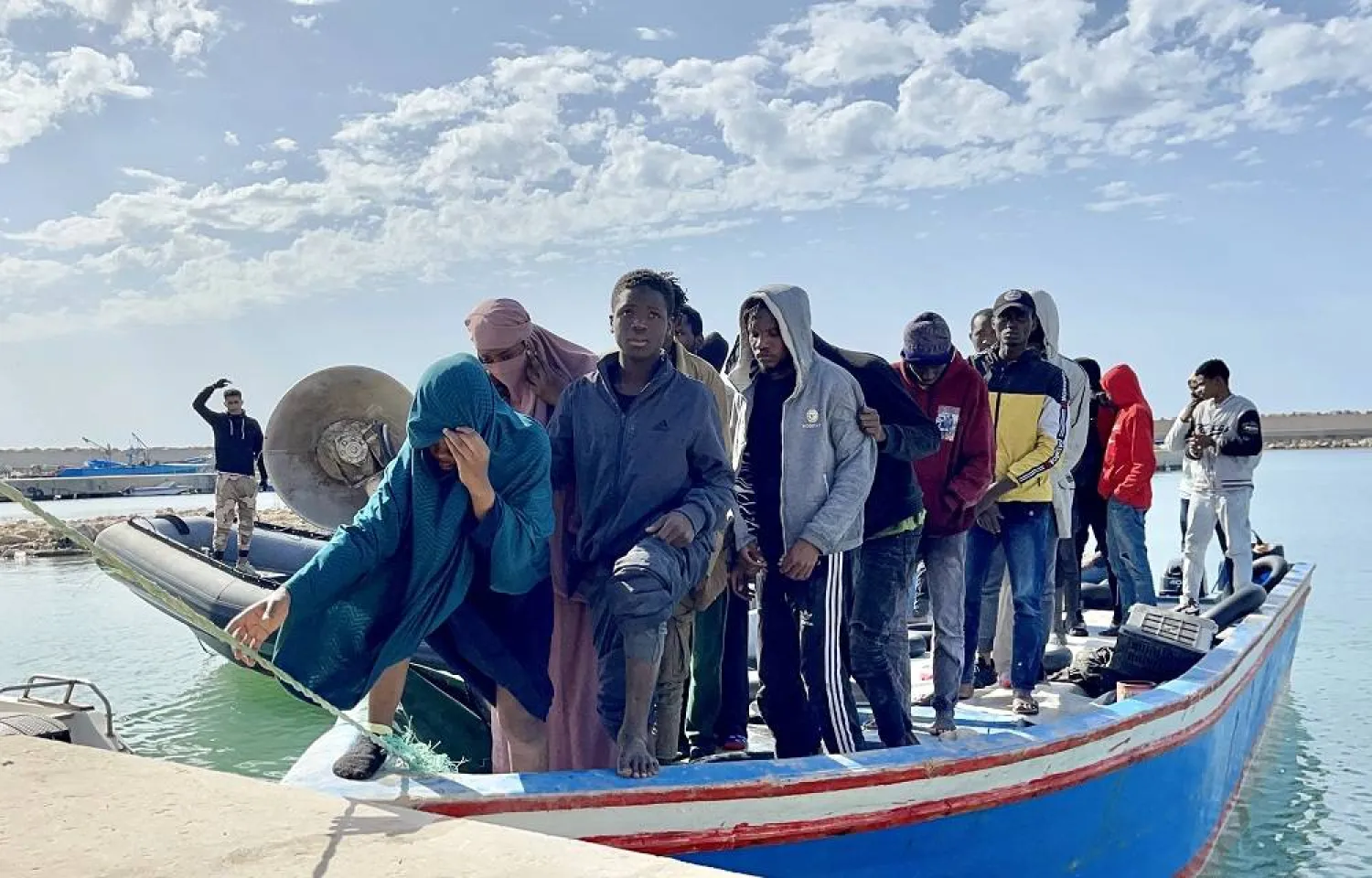 Individuals rescued by the Libyan Coast Guard after a boat carrying migrants sank off the coast of Tripoli, on April 25, 2023, killing 11. (Getty Images)