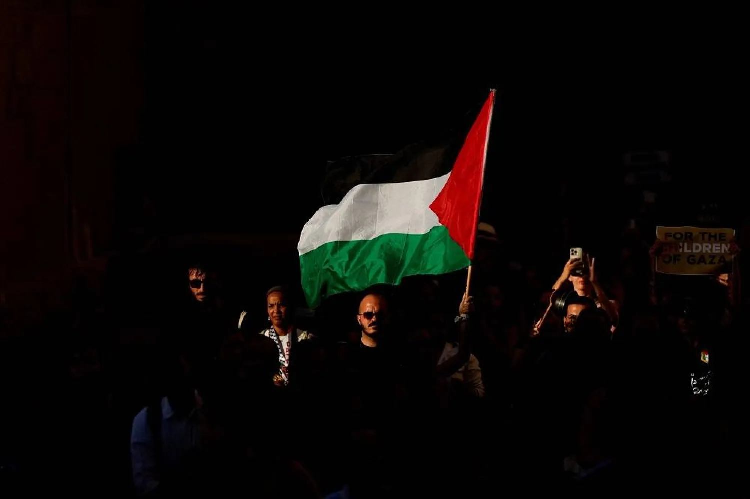 A demonstrator holds a Palestinian flag during an "Act NOW against Genocide in Gaza" protest, amid the ongoing conflict between Israel and Hamas, in Valletta, Malta, July 29, 2025. (Reuters)