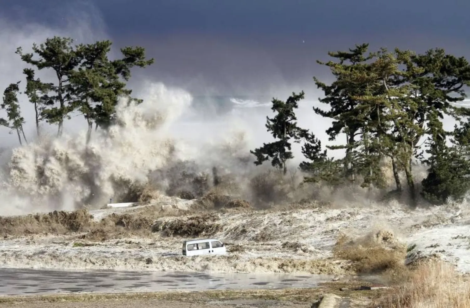 Tsunami waves hit the coast of Minamisoma in Fukushima Prefecture, photographed on March 11, 2011. (Sadatsugu Tomizawa / AFP / Getty Images) 