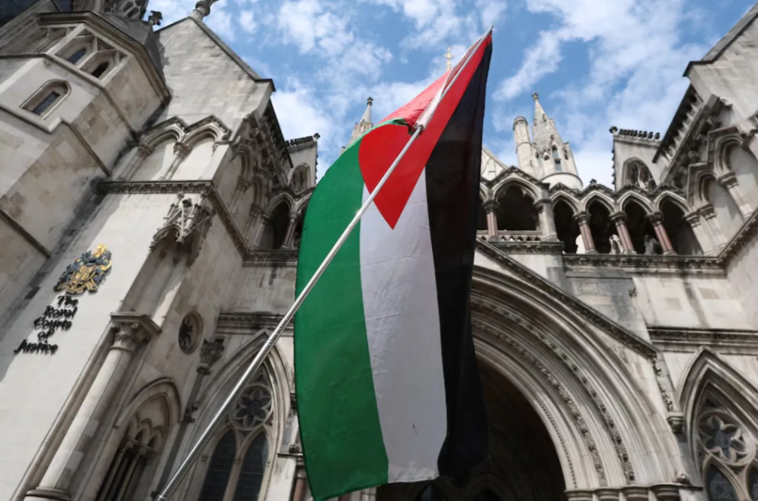 A Palestinian flag is seen, outside London's High Court as judges decide whether the co-founder of Palestine Action can challenge the UK government's ban on the group, in London, Britain, July 30, 2025. REUTERS/Toby Melville 