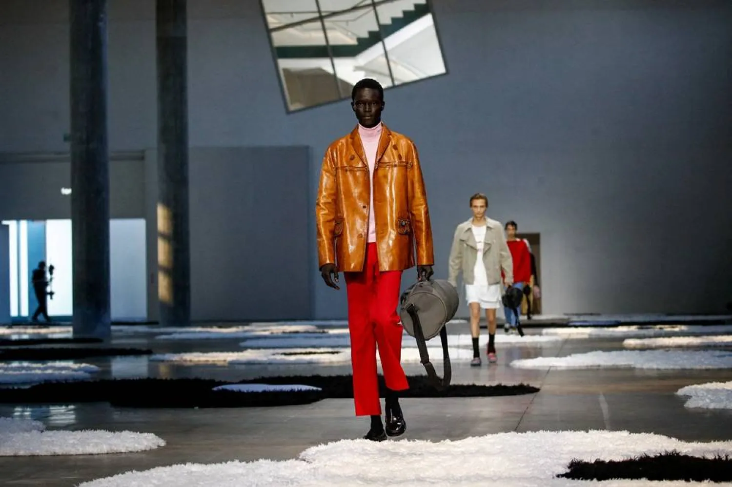 Models present creations from Prada Spring-Summer 2026 menswear collection during the Milan Fashion Week in Milan, Italy, June 22, 2025. (Reuters)