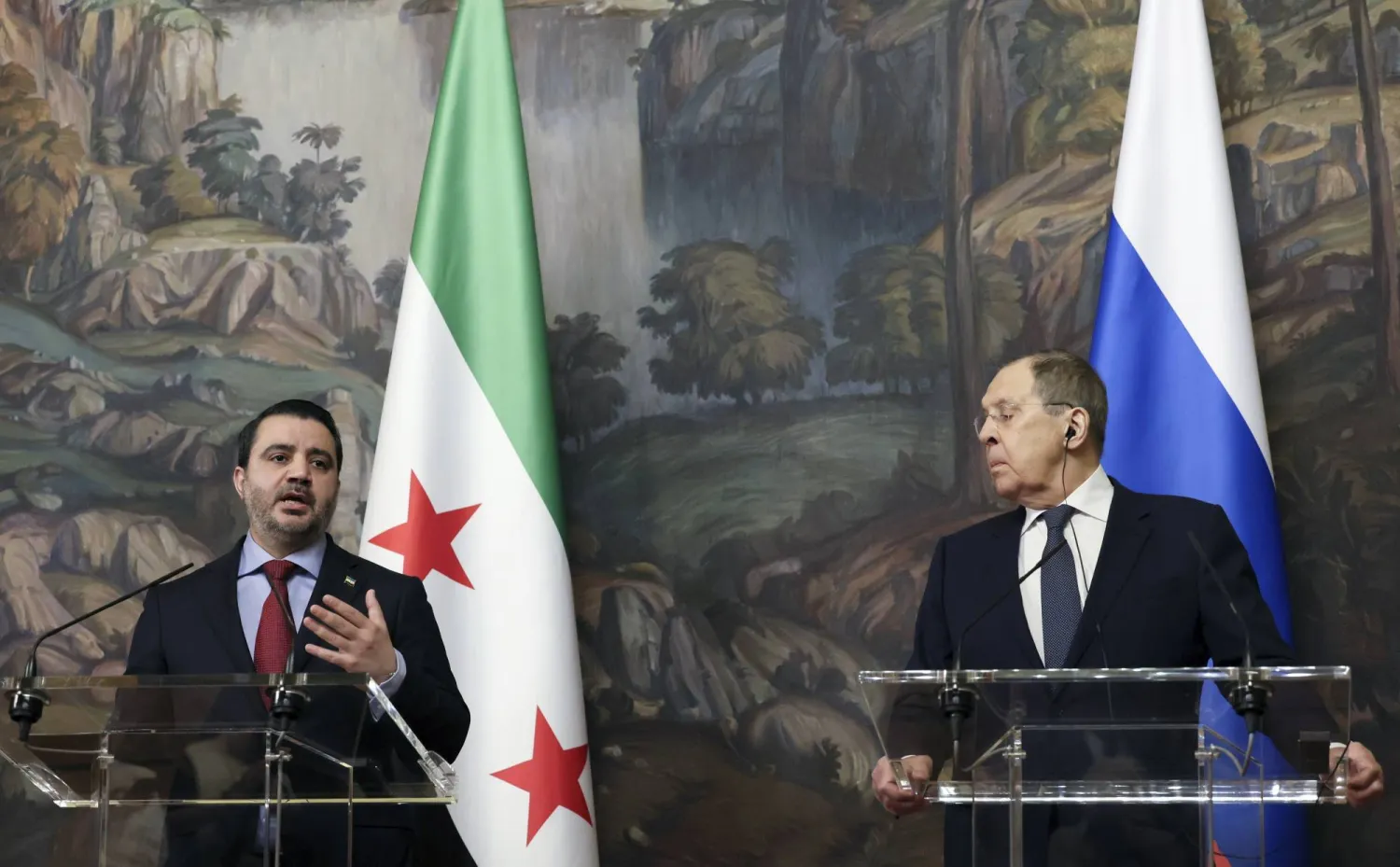 Syrian Foreign Minister Asaad Hassan al-Shibani (L) speaks during a press conference with Russian Foreign Minister Sergey Lavrov (R) following their meeting in Moscow, Russia, 31 July 2025.  EPA/SHAMIL ZHUMATOV/ POOL