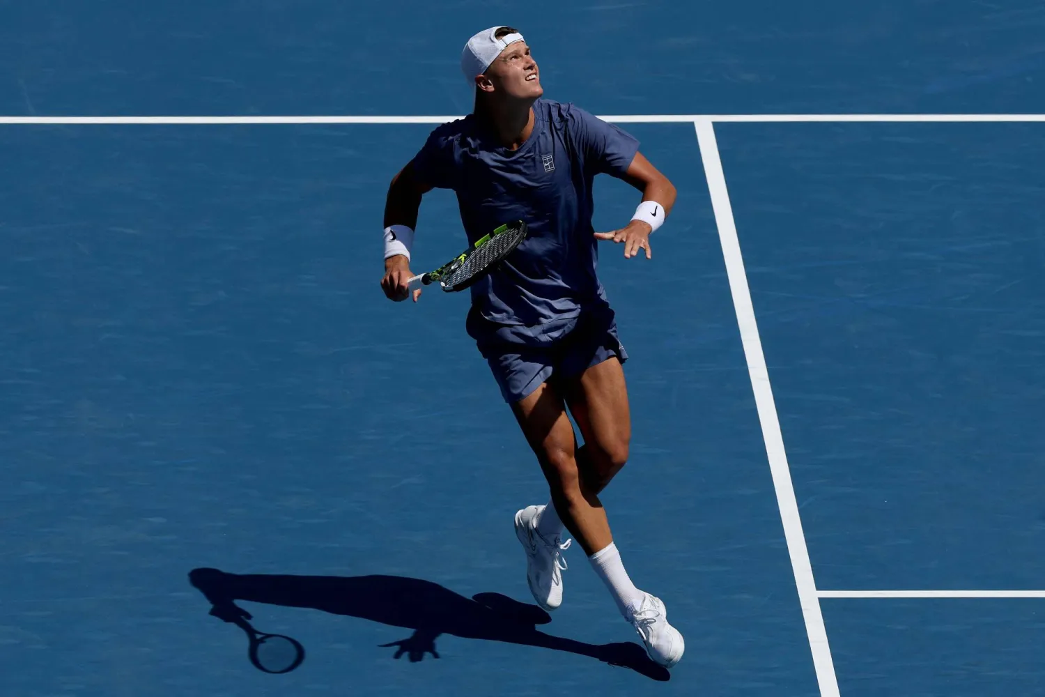 TORONTO, ONTARIO - JULY 29: Holger Rune of Denmark backs up for a shot against Giovanni Mpetshi Perricard of France during the National Bank Open Presented by Rogers at Sobeys Stadium on July 29, 2025 in Toronto, Ontario. Matthew Stockman/Getty Images/AFP 