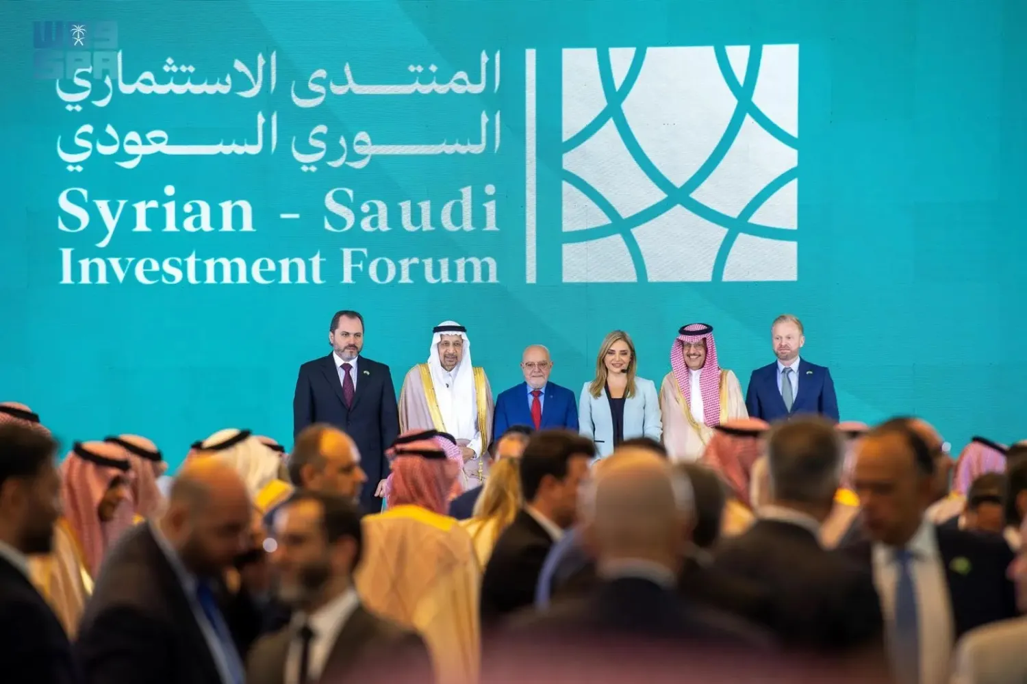 Officials are seen at the Syrian-Saudi Investment Forum in Damascus. (SPA)