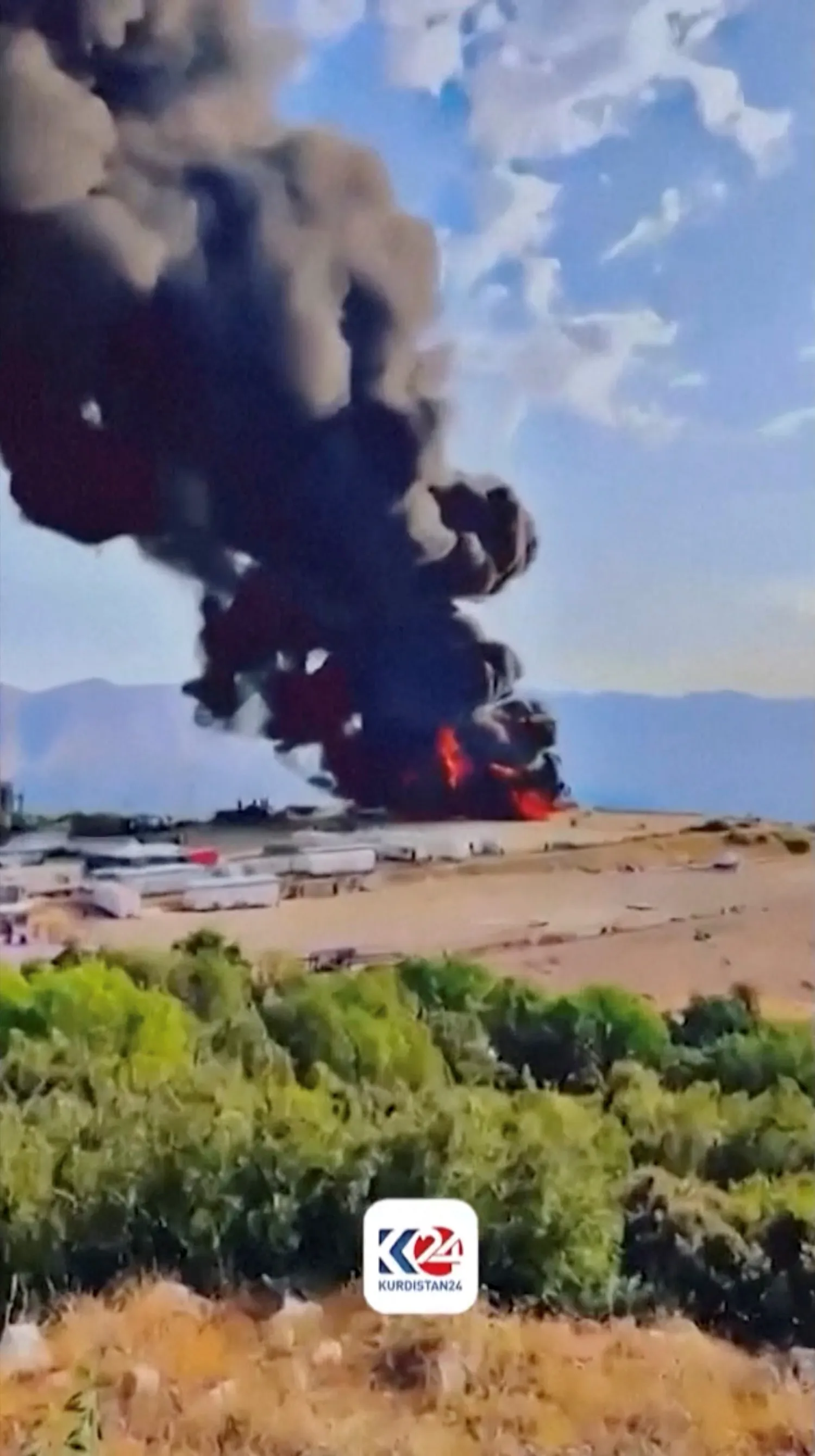 Black smoke rises from a roaring fire at Sarsang oilfield, following a drone attack, in Dohuk, Iraq July 15, 2025, in this screen grab taken from a handout video. KURDISTAN 24/Handout via REUTERS 