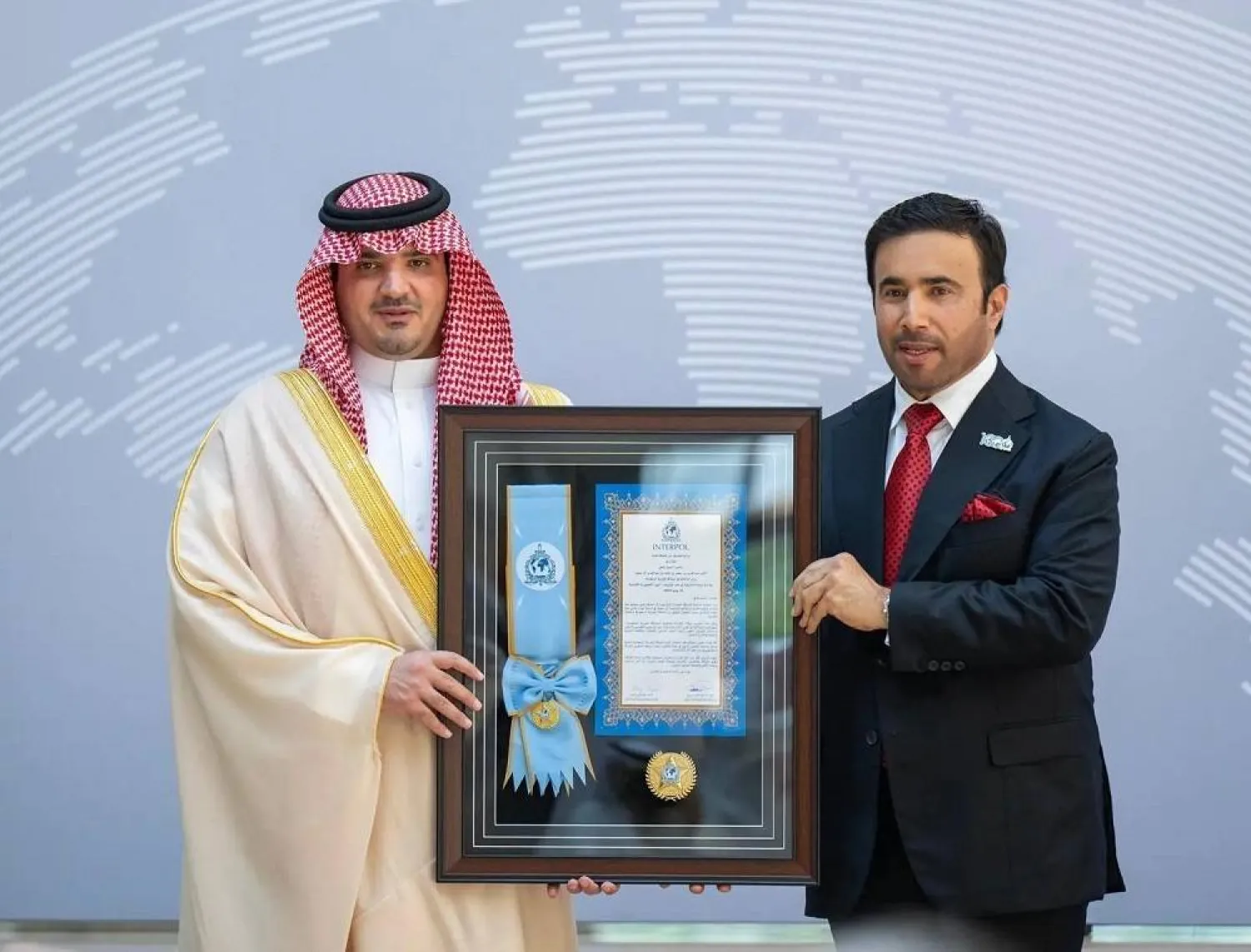 Saudi Minister of Interior Prince Abdulaziz bin Saud bin Naif bin Abdulaziz receives Interpol’s Medal of the Highest Order. (SPA) 