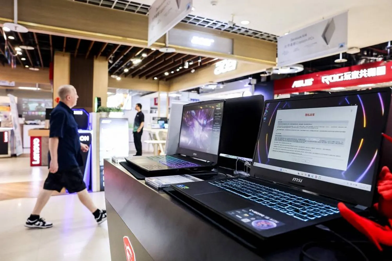 Laptops of Taiwanese electronics maker MSI are displayed for sale at a computer market in Taipei on August 1, 2025. (AFP)