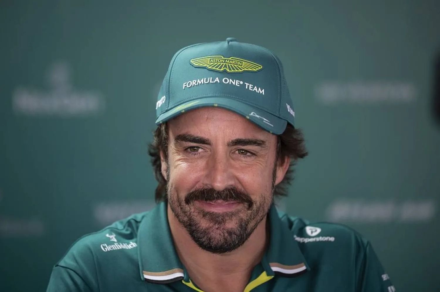 Aston Martin driver Fernando Alonso of Spain smiles ahead of the Formula One Hungarian Grand Prix at the Hungaroring racetrack in Mogyorod near Budapest, Hungary, Thursday, July 31, 2025. (AP)