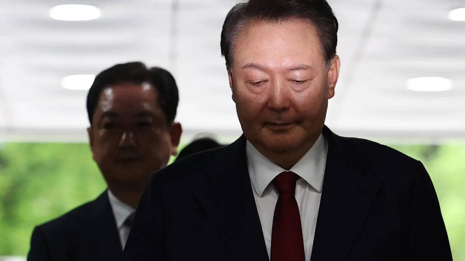 South Korea's former president Yoon Suk Yeol resisted prosecutors' attempts to interrogate him by lying down on the floor in his underwear. KIM HONG-JI / POOL/AFP

