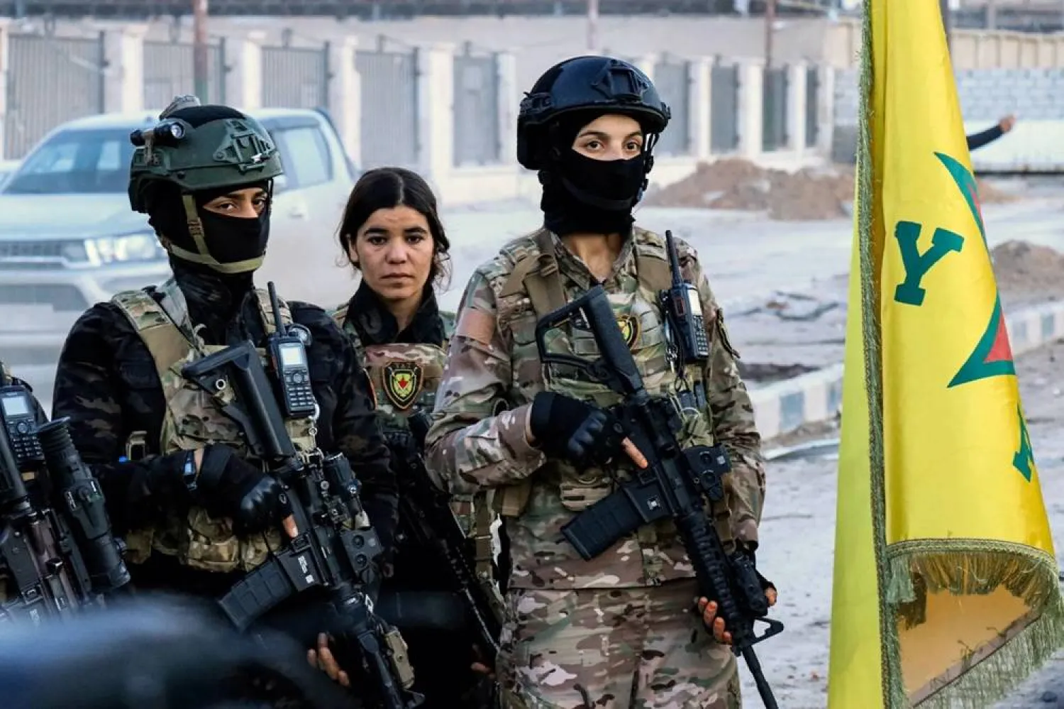 Members of the Syrian Democratic Forces (SDF) deploy outside Ghwayran prison in Syria's northeastern city of Hasakah on January 26, 2022. (AFP)