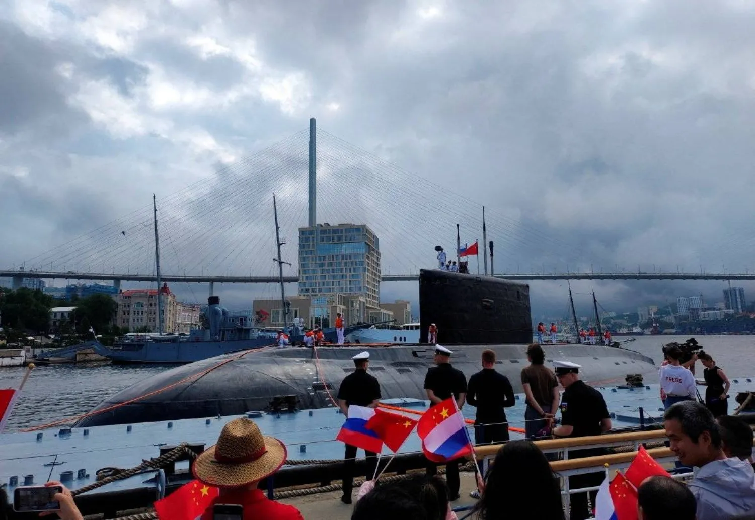 People take part in a ceremony marking the start of the upcoming Russian-Chinese joint naval drills in the Sea of Japan, following the arrival of Chinese military vessels in Vladivostok, Russia, July 31, 2025. (Russian Defense Ministry/Russia's Pacific Fleet/Handout via Reuters) 