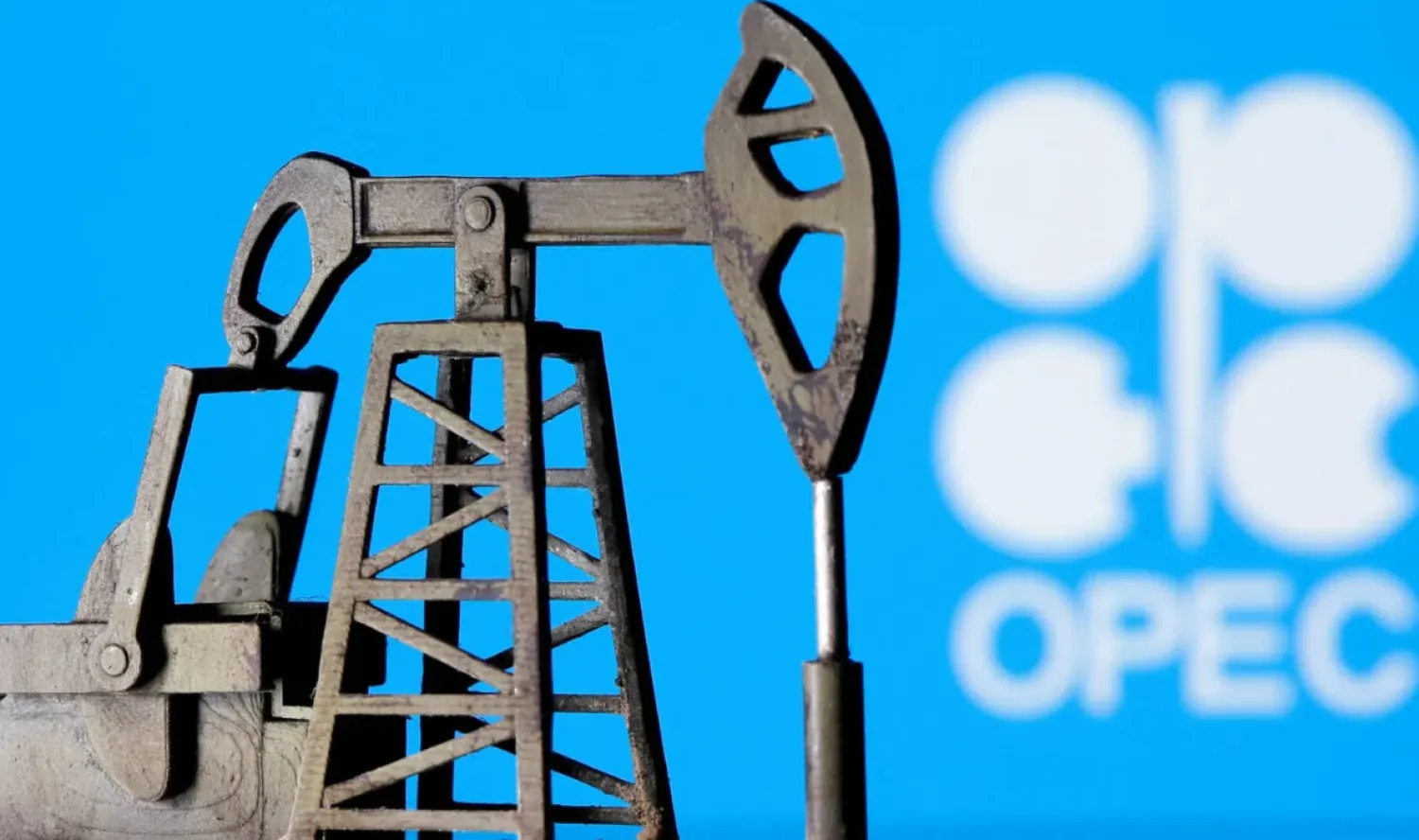 A 3D-printed oil pump jack is seen in front of the OPEC logo (File Photo: Reuters)
