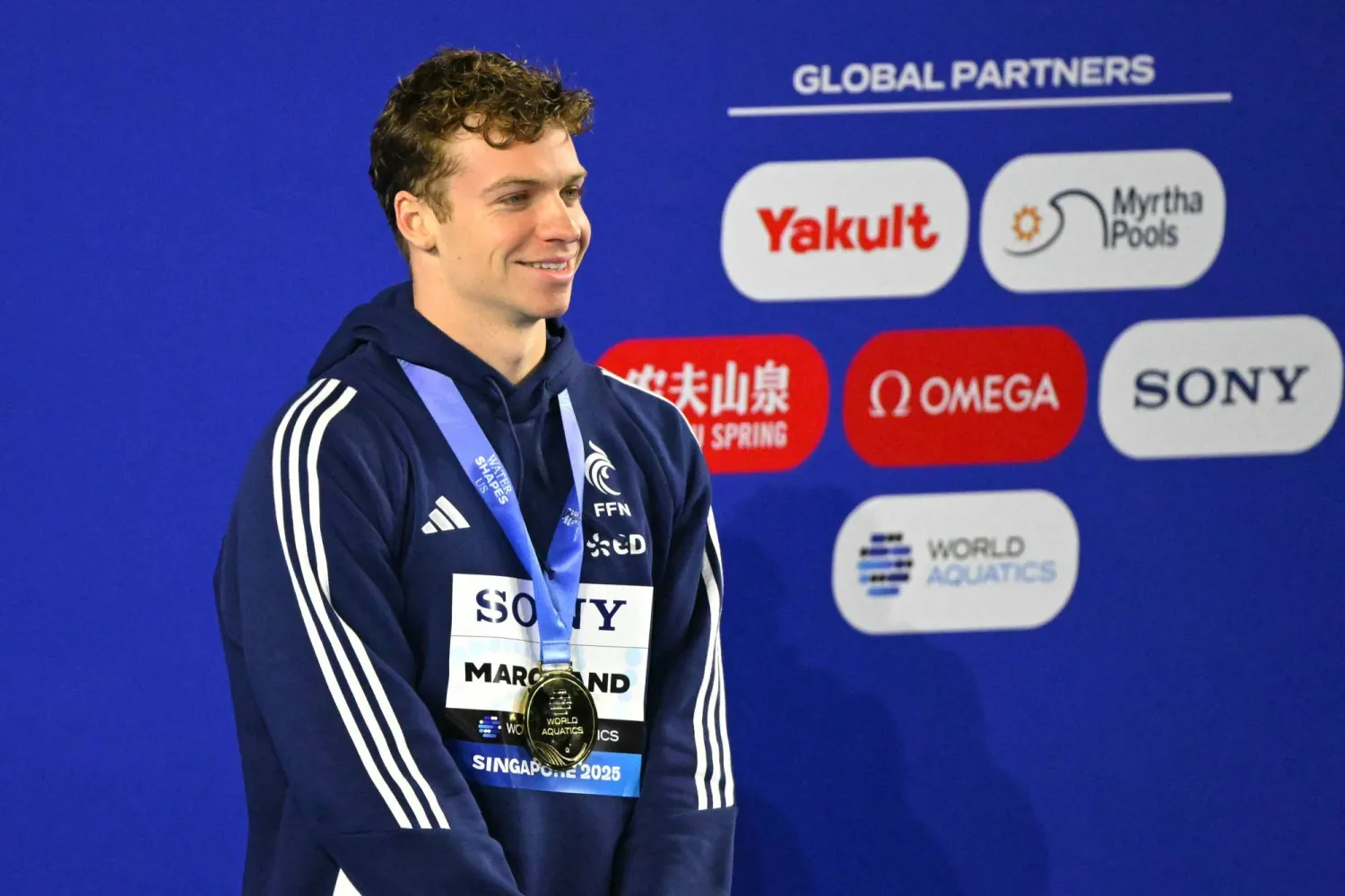 جانب من تتويج مارشان بالميدالية الذهبية الثانية (أ.ف.ب)