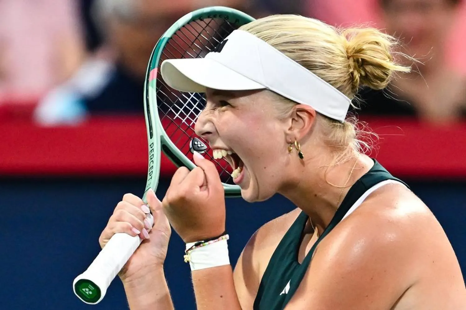 Clara Tauson of Denmark celebrates a victory against Iga Swiatek of Poland during their fourth round singles women's match on Day Eight of the WTA 1000 National Bank Open at IGA Stadium on August 3, 2025 in Montreal, Quebec, Canada. (Getty Images/AFP) 