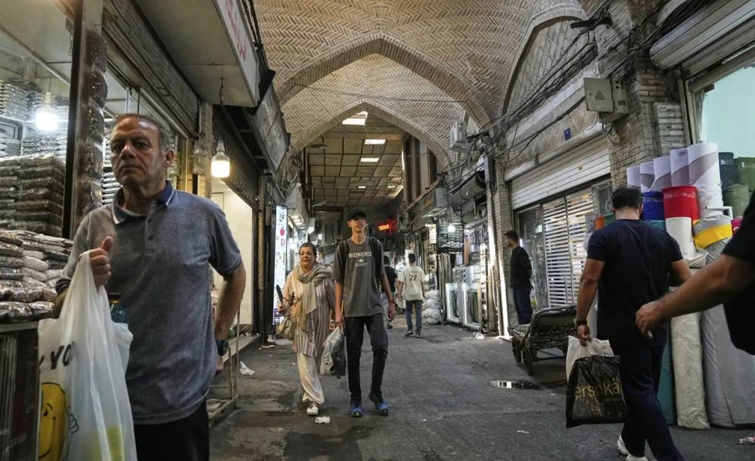  People walk through the old main bazaar of Tehran, Iran, Thursday, July 31, 2025. (AP) 