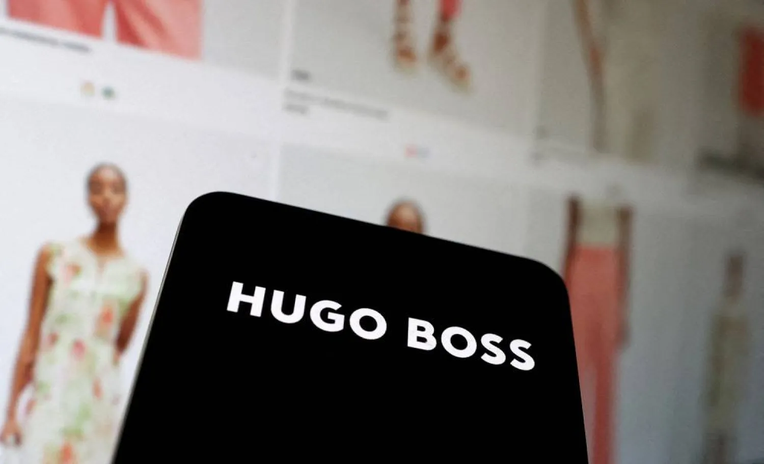 The new Hugo Boss logo and their website shop are seen in this illustration taken, May 17, 2024. (Reuters)