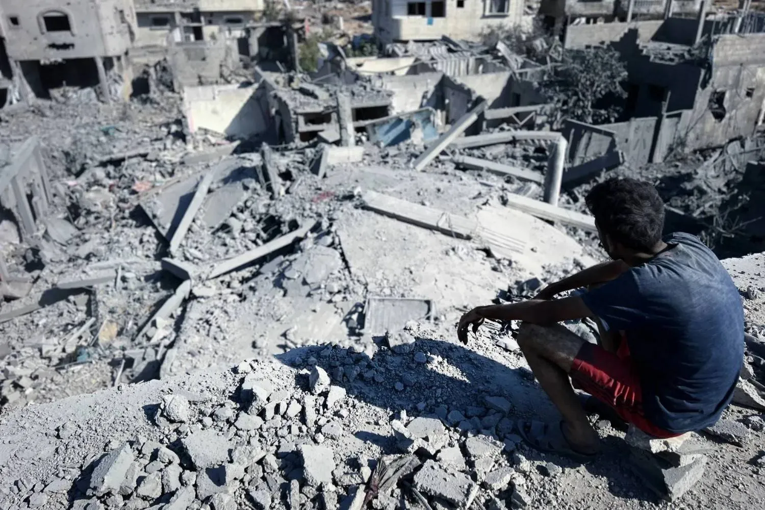 A Palestinian surveys destruction from an Israeli strike in Nuseirat, central Gaza, on Wednesday (DPA)