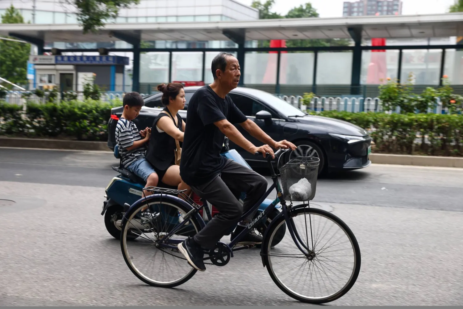 A man rides a bike on a street in Beijing, China, 04 August 2025.  EPA/WU HAO