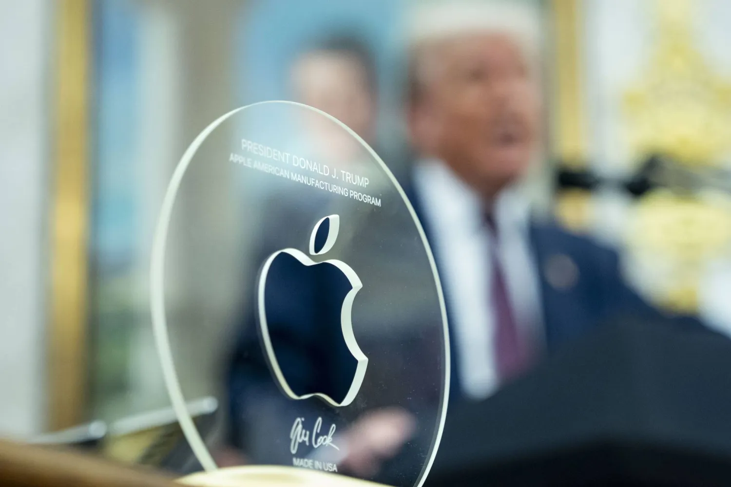 A plaque commemorating President Donald Trump’s and Apple CEO Tim Cook's announcement an additional $100 billion Apple investment in the US in the Oval Office of the White House in Washington, DC, USA, 06 August 2025. EPA/BONNIE CASH / POOL