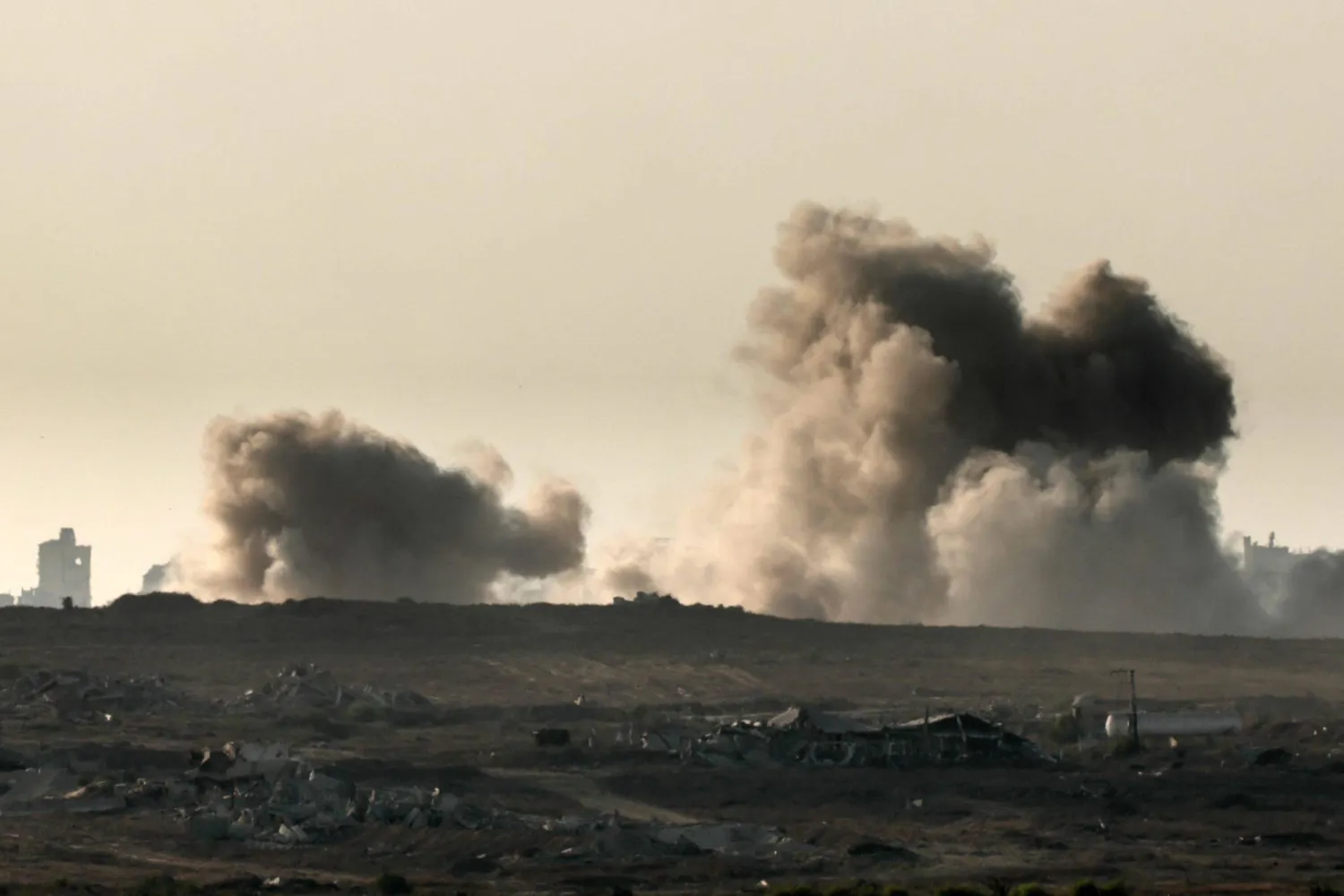 This picture taken from a position on the Israeli border with the Gaza Strip, shows smoke rising during an Israeli strike on the besieged Palestinian territory on August 7, 2025. (Photo by Jack GUEZ / AFP)