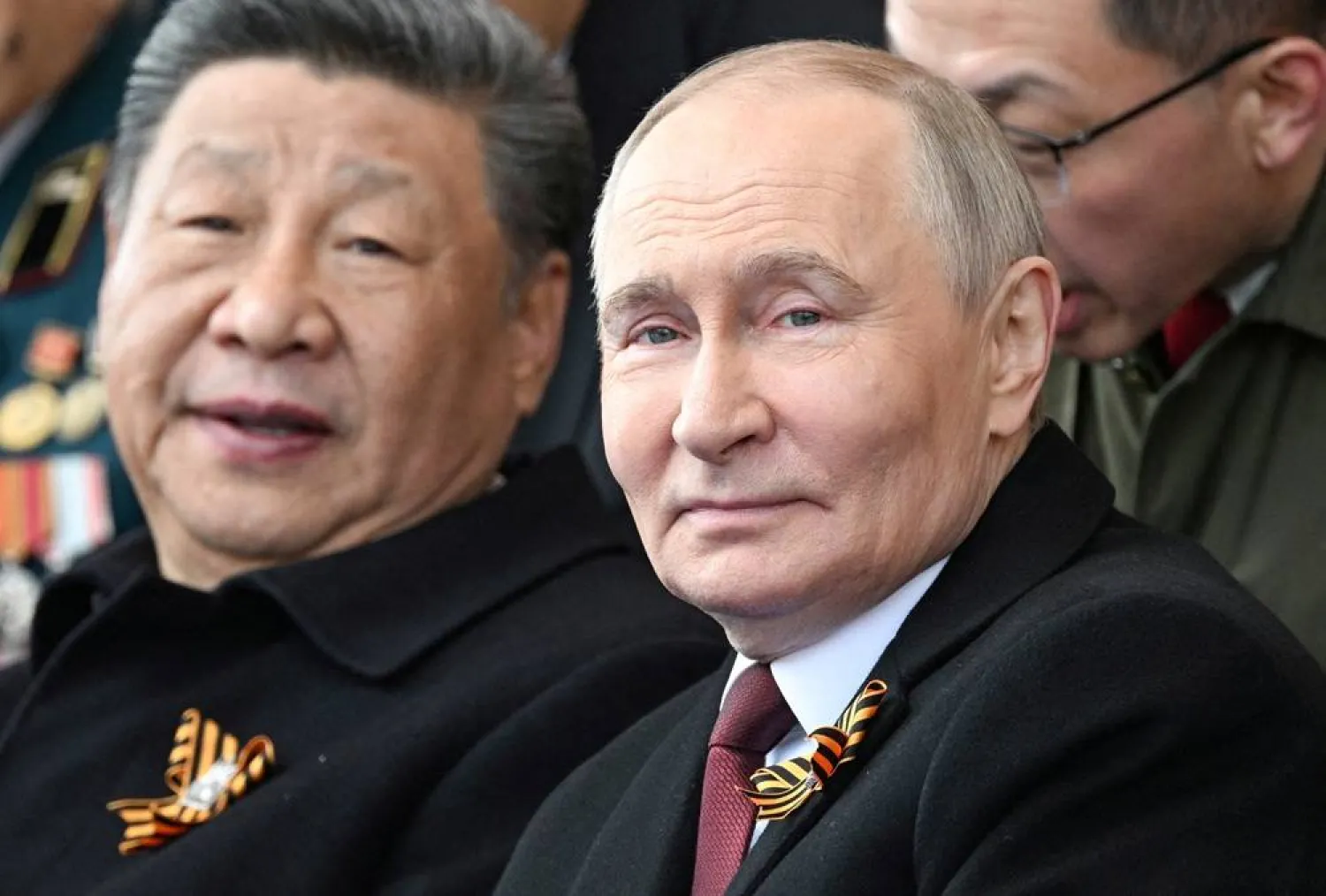 Russian President Vladimir Putin and his Chinese counterpart Xi Jinping attend a military parade on Victory Day, marking the 80th anniversary of the victory over Nazi Germany in World War Two, in Red Square in central Moscow, Russia, May 9, 2025. (Sergei Bobylyov/Host agency RIA Novosti/Handout via Reuters)