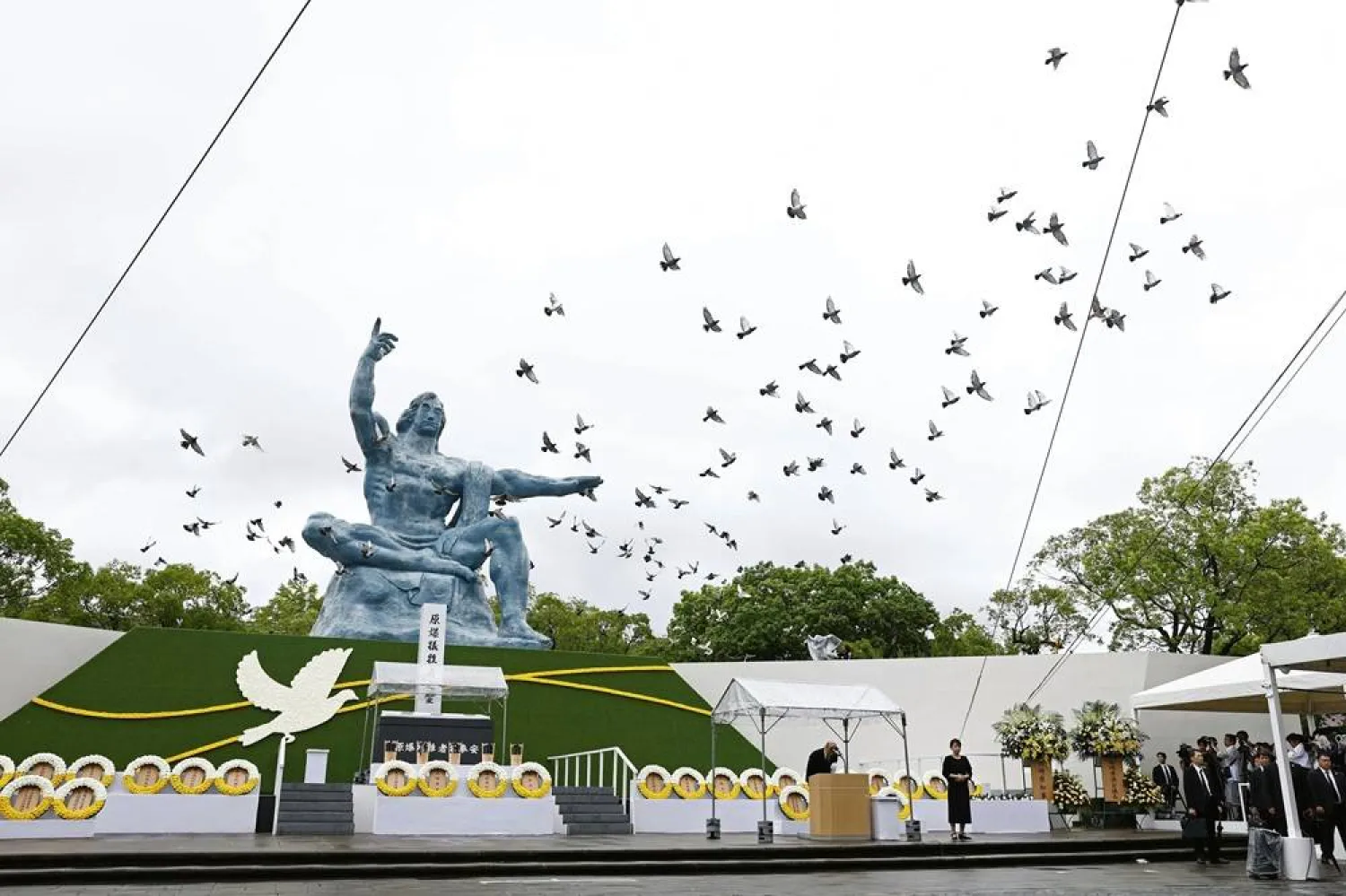 Doves are leased over the Peace Statue during a ceremony to mark the 80th anniversary of the US atomic bombing at the Peace Park in Nagasaki, southern Japan Saturday, Aug. 9, 2025. (Kyodo News via AP) 