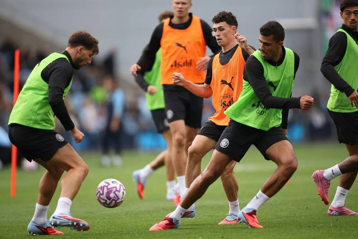 (L-R) Ruben Dias, Phil Foden, and Rodri of Manchester City take part in an open training session during a season launch event in Manchester, Britain, 05 August 2025. (EPA) 