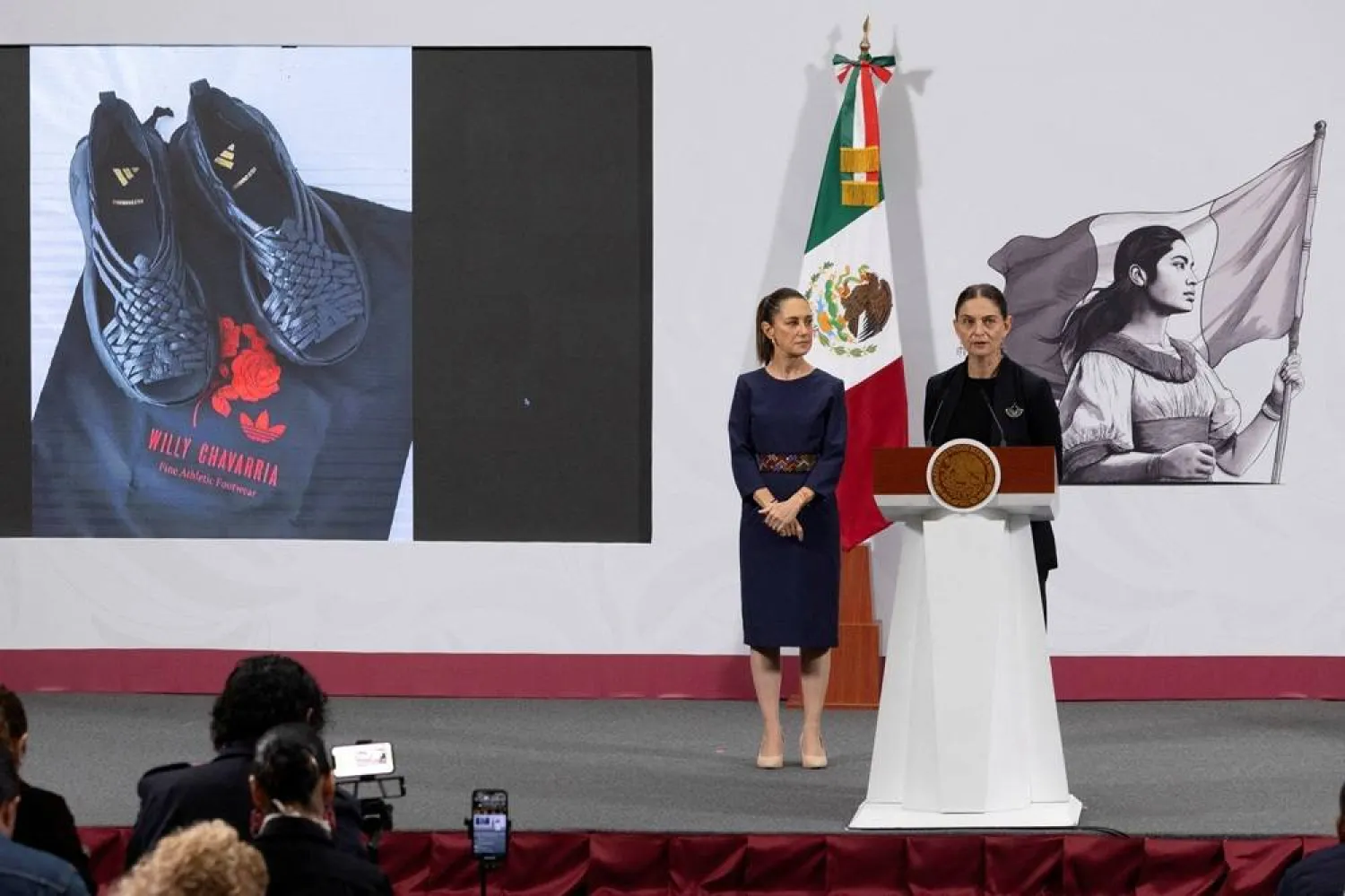 Marina Nunez Bespalova, Mexico’s Undersecretary of Cultural Development, speaks during President Claudia Sheinbaum’s morning press conference at the National Palace to condemn Adidas and US designer Willy Chavarria over the “Oaxaca Slip On” shoe, accused of misappropriating a sandal design rooted in Zapotec Indigenous heritage, in Mexico City, Mexico, August 8, 2025. (Presidencia de Mexico/Handout via Reuters)