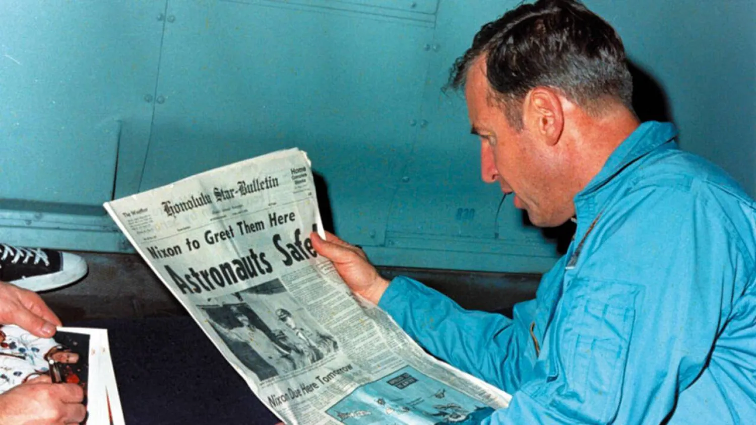 Astronaut Jim Lovell reads the news after his crew returned safely to Earth from a failed Moon mission in 1970. Handout / NASA/AFP/File
