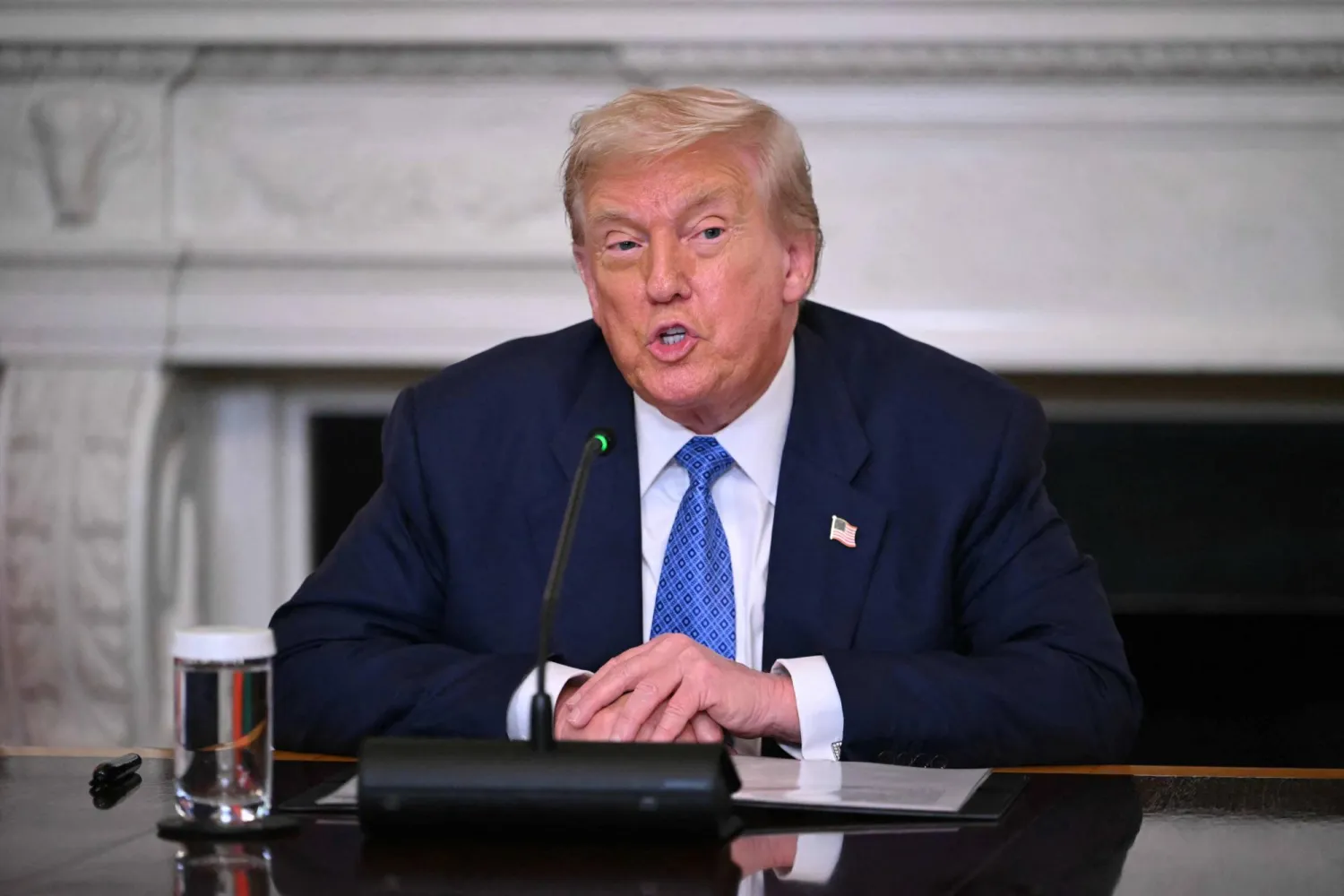US President Donald Trump participates in a trilateral signing with Azerbaijani President Ilham Aliyev and Armenian Prime Minister Nikol Pashinyan in the State Dining Room of the White House in Washington, DC, on August 8, 2025. (Photo by ANDREW CABALLERO-REYNOLDS / AFP)
