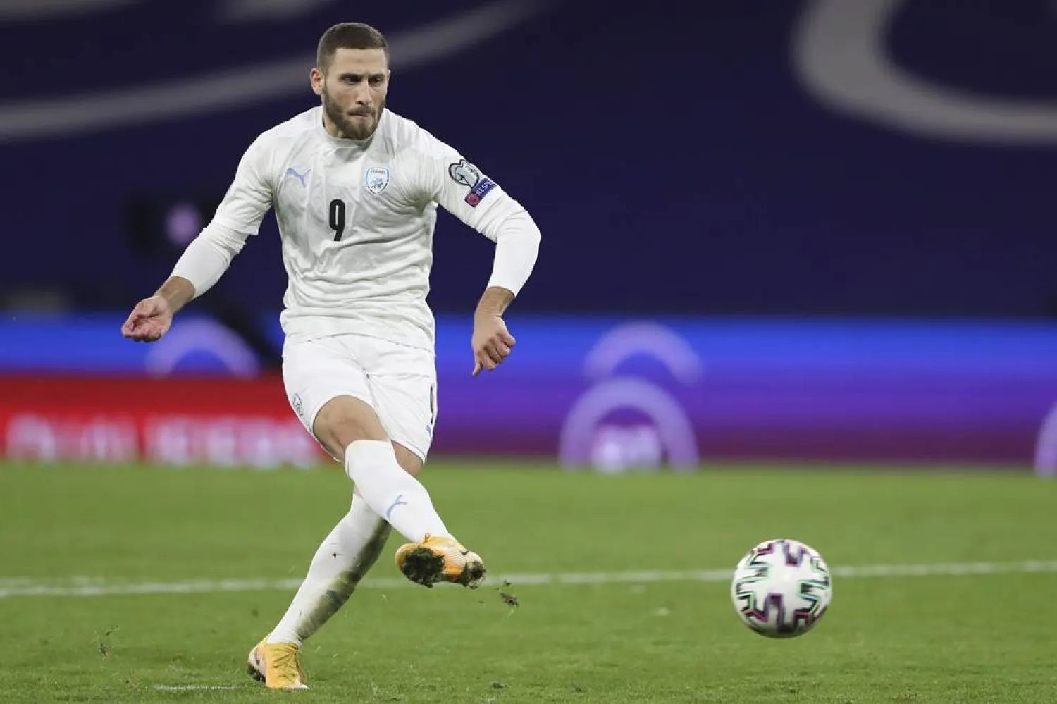 Israel's Shon Weissman shoots a penalty shot during the Euro 2020 playoff semifinal soccer match between Scotland and Israel, at the Hampden stadium in Glasgow, Scotland, Thursday, Oct. 8, 2020. (AP)
