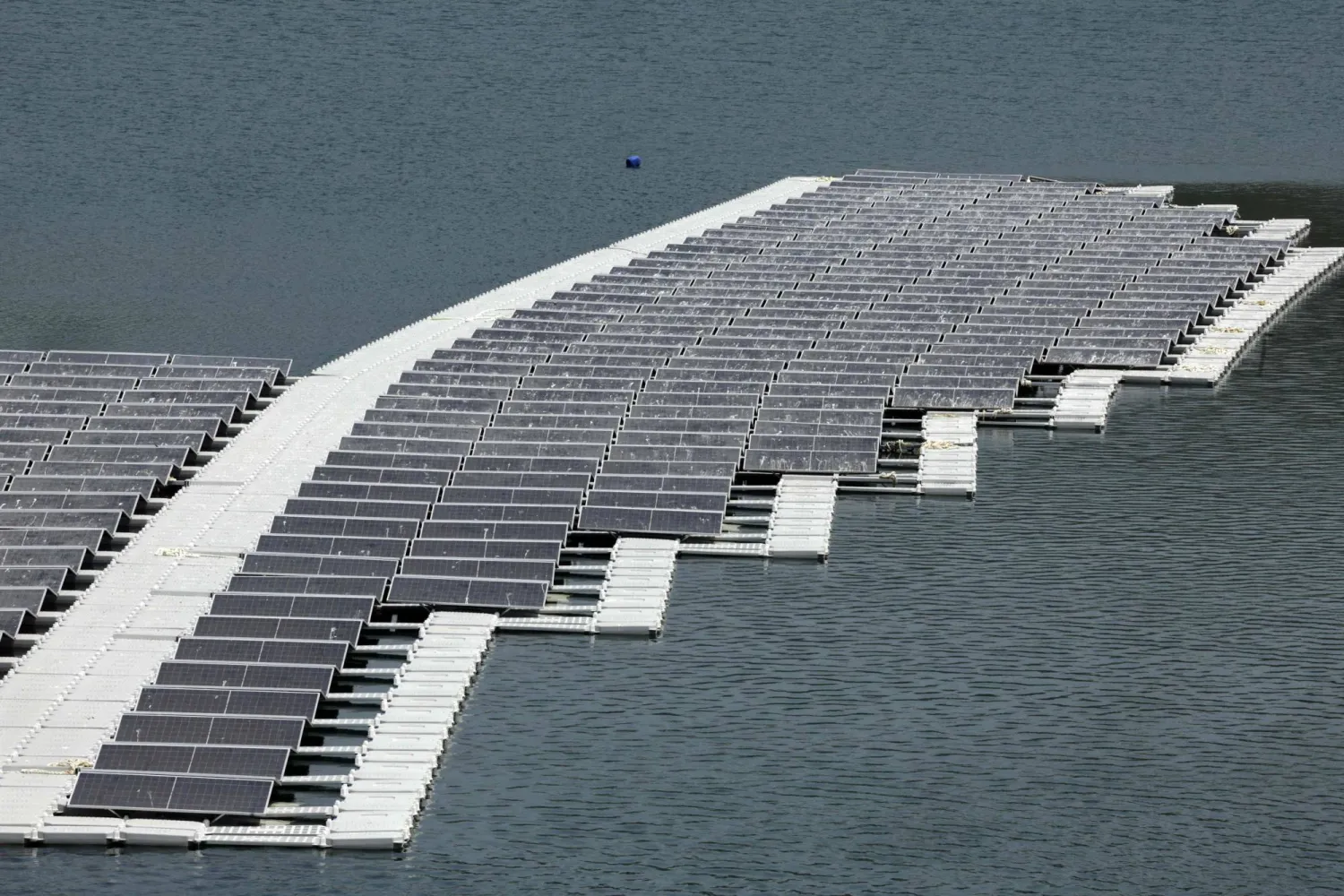 A floating photovoltaic solar installation in put in place on the Oued Rmel dam, as part of a solar pannel farm near the Tanger Med port in the province of Fahs-Anjra, west of the city of Tangiers on August 7, 2025. (Photo by Abdel Majid BZIOUAT / AFP)