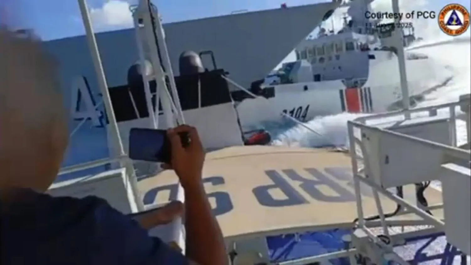 This screen grab released by the Philippine Coast Guard shows the Monday incident between a Chinese Navy vessel (L) and a China Coast Guard ship. Handout / Philippine Coast Guard (PCG)/AFP