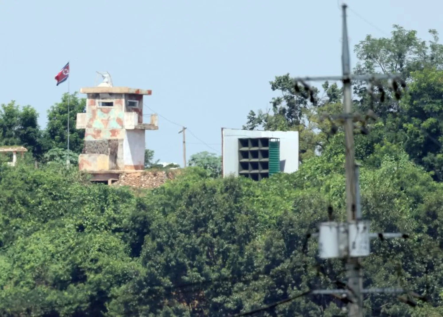 A North Korean guard post near the border city of Paju, is seen along with a loudspeaker installation used to blare noise across the border into the South, in this photo taken Aug. 10, 2025. (dpa)